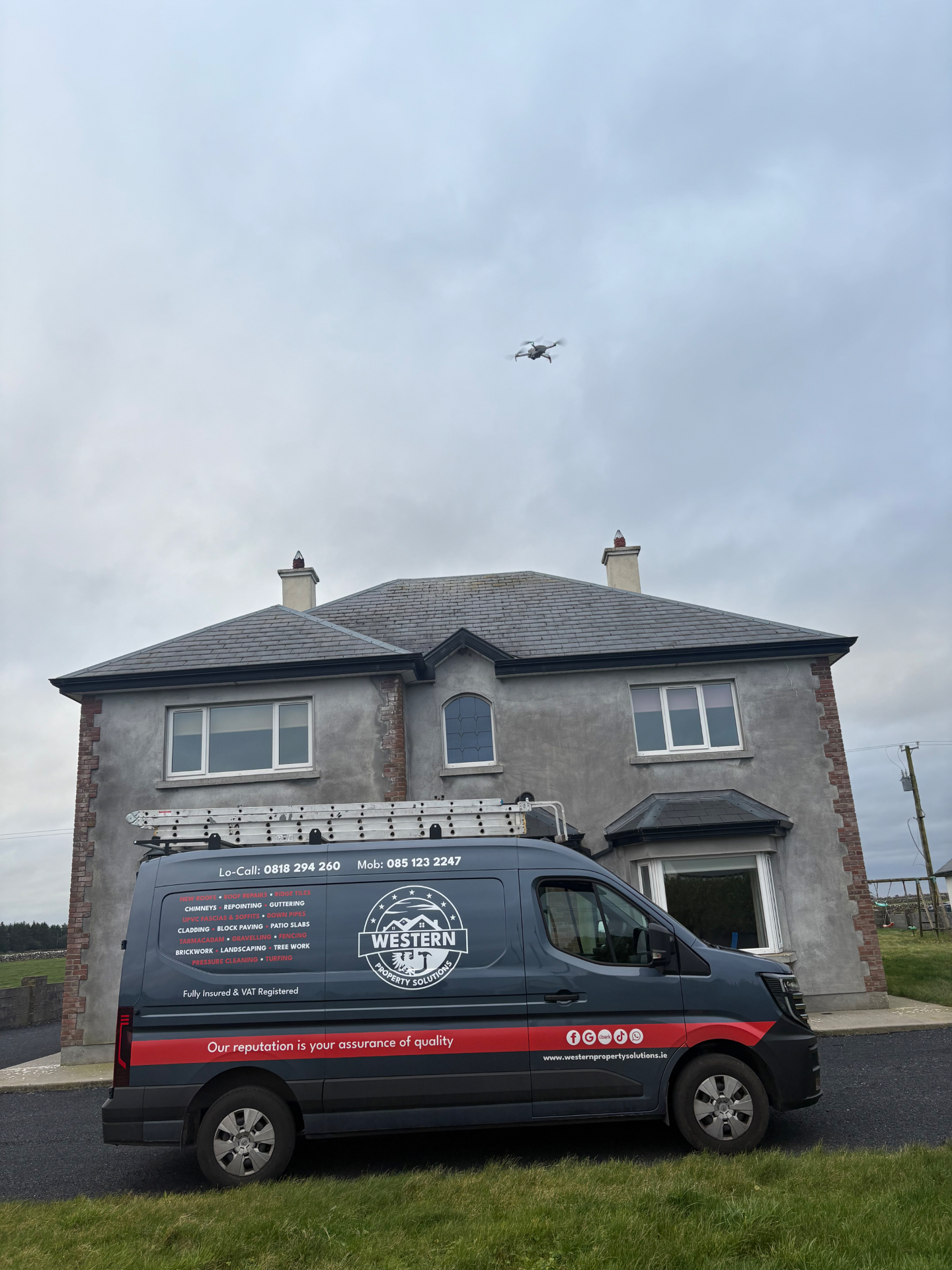 Western Property Solutions van parked outside a two-storey house while a drone inspects the slate roof